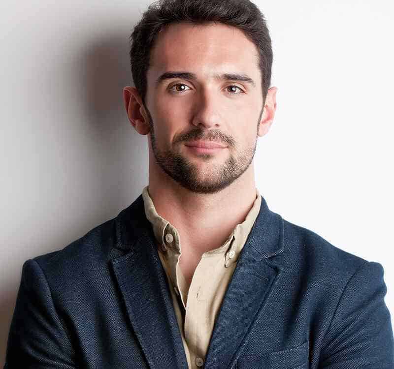 Dispensary professional man in business attire, representing expertise in cannabis dispensary servic.