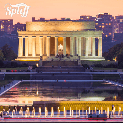 Lincoln Memorial at sunset in Miami, FL, with illuminated fountain in foreground.